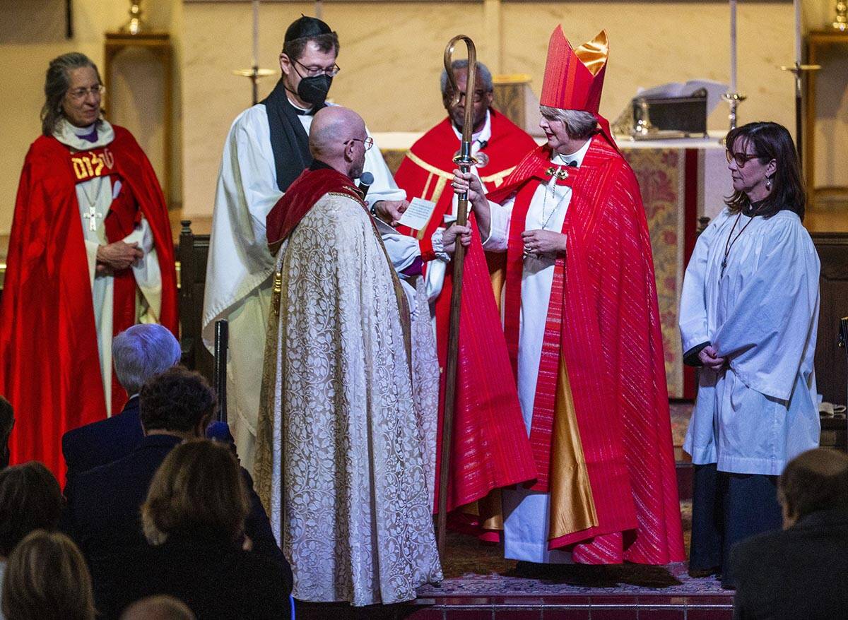 Bishop Elizabeth Bonforte Gardner receives her Bishop’s staff while consecrated the next ...