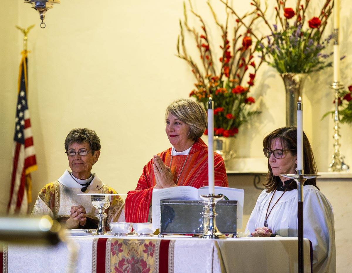 Bishop Rev. Elizabeth Bonforte Gardner, center, gives the Eucharist after consecrated the next ...