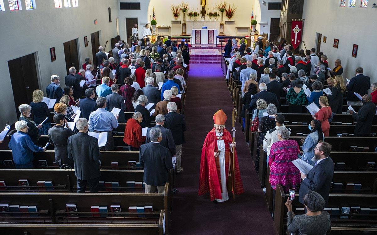 Bishop Elizabeth Bonforte Gardner recedes from the chapel past invited guests after consecrated ...