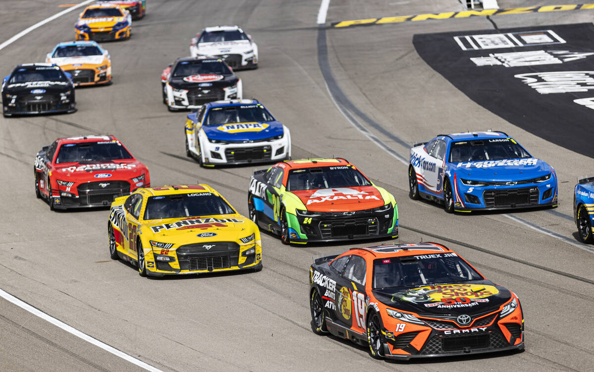 NASCAR Cup Series driver Martin Truex Jr. (19) leads the pack during the Pennzoil 400 NASCAR Cu ...