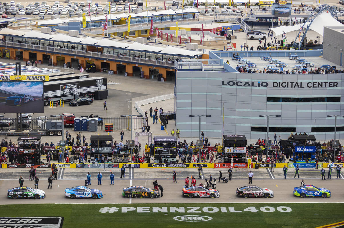 Drivers stand by their cars before the start of the Pennzoil 400 NASCAR Cup Series race on Sund ...