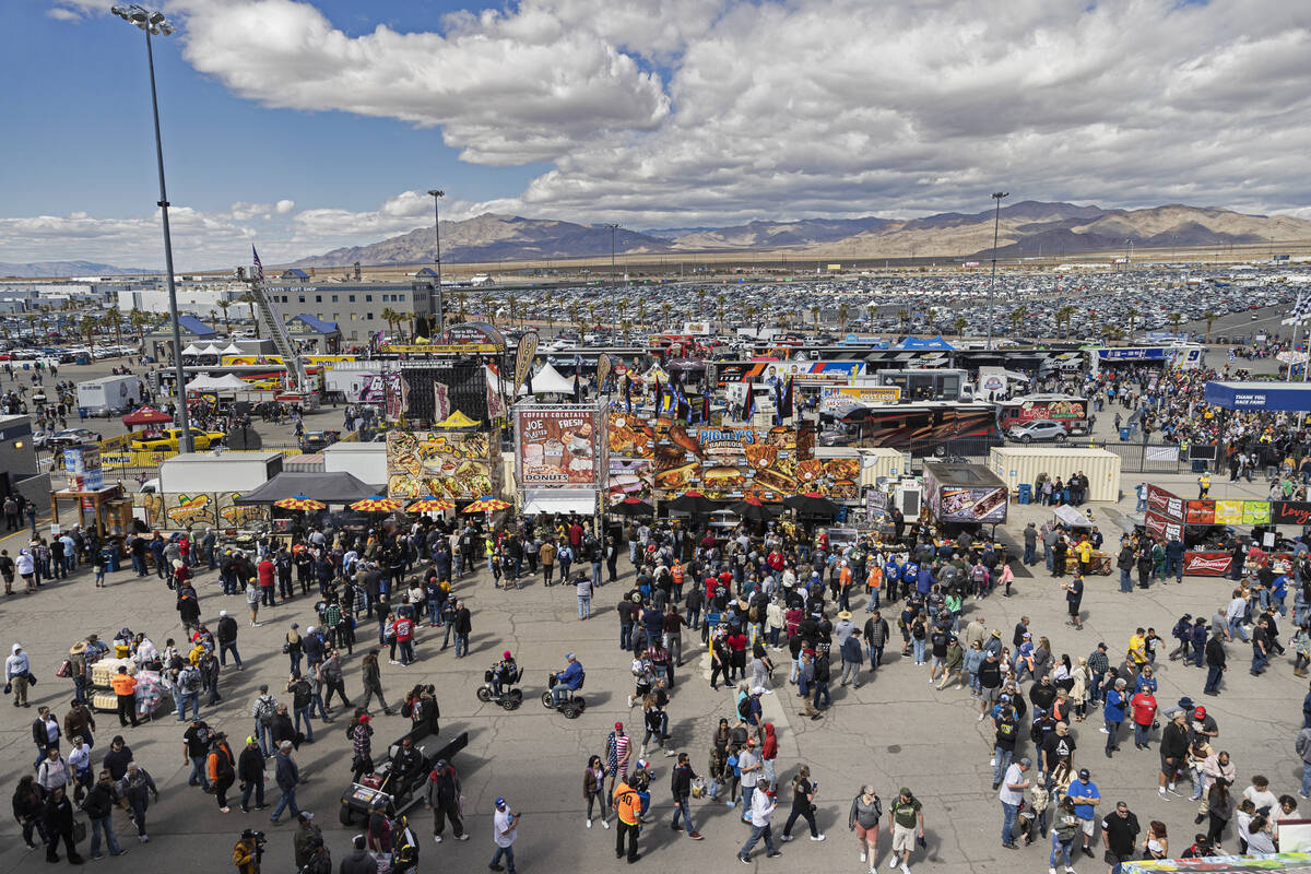 People file into Las Vegas Motor Speedway during the Pennzoil 400 NASCAR Cup Series race on Sat ...