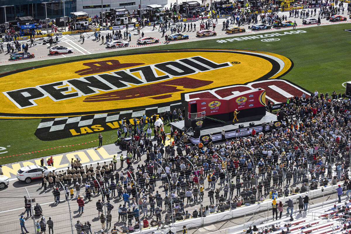 NASCAR Cup Series driver Kyle Busch (18) is announced before the start of the Pennzoil 400 NASC ...