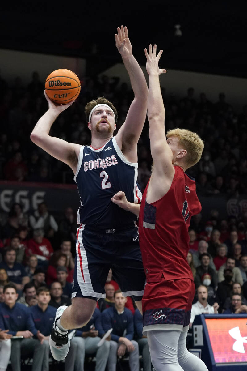 Gonzaga forward Drew Timme (2) shoots against Saint Mary's forward Matthias Tass during an NCAA ...