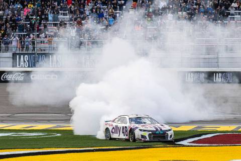 NASCAR Cup Series driver Alex Bowman (48) celebrates with a burn out after winning the Pennzoil ...
