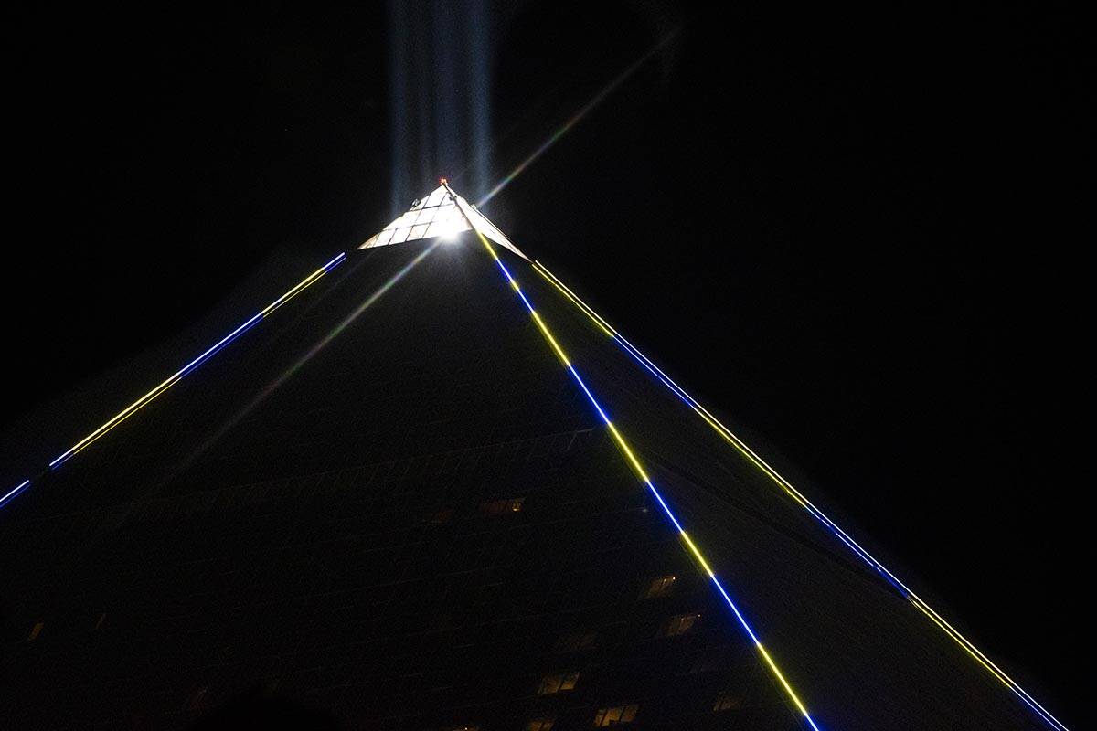 The Luxor illuminates with yellow and blue colors in support of Ukraine on Sunday, March 6, 202 ...