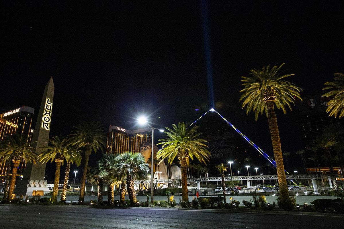 The Luxor illuminates with yellow and blue colors in support of Ukraine on Sunday, March 6, 202 ...