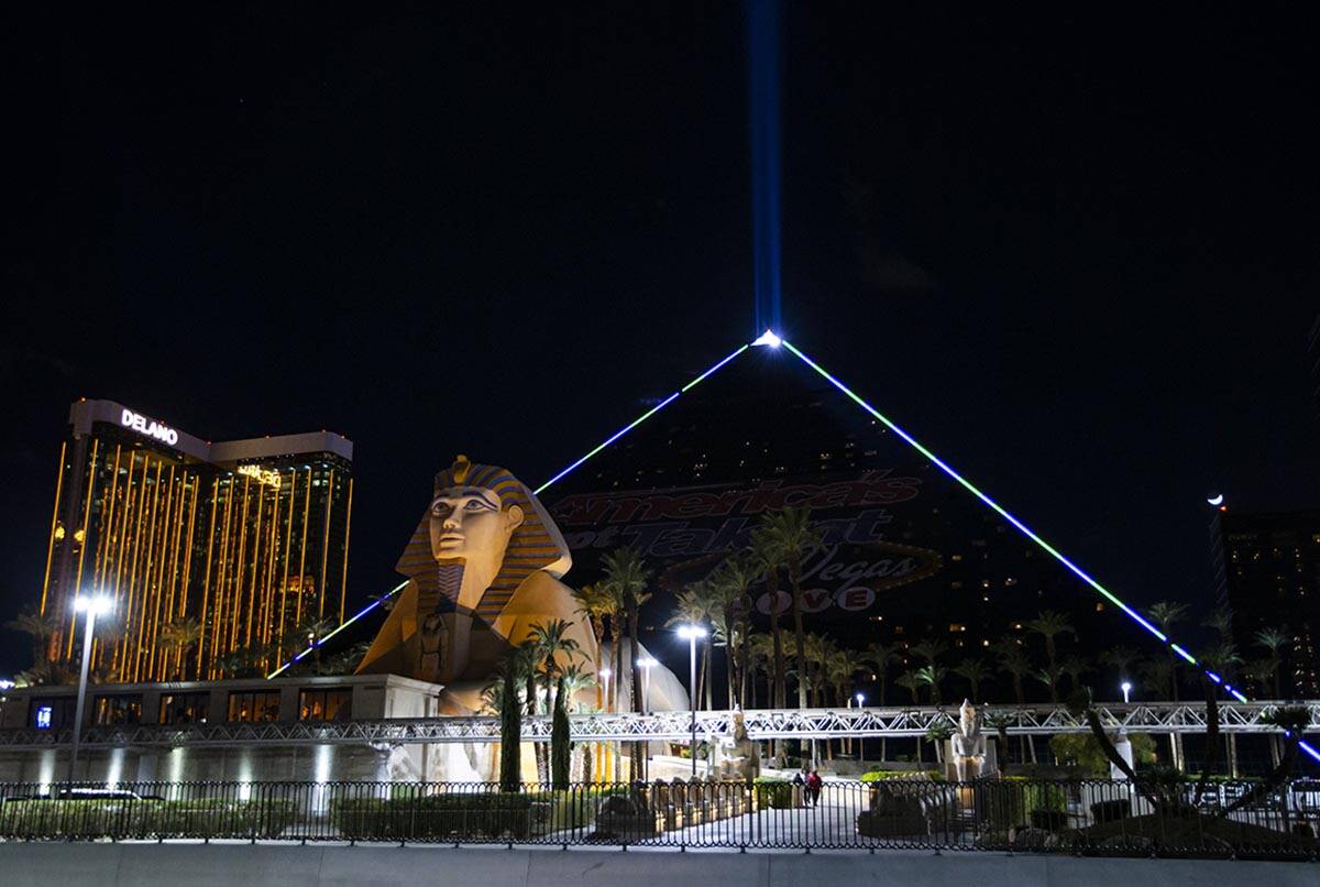 The Luxor illuminates with yellow and blue colors in support of Ukraine on Sunday, March 6, 202 ...