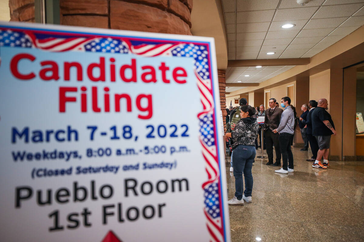 Candidates wait in line to file to run for office for Nevada’s primary election, at the ...