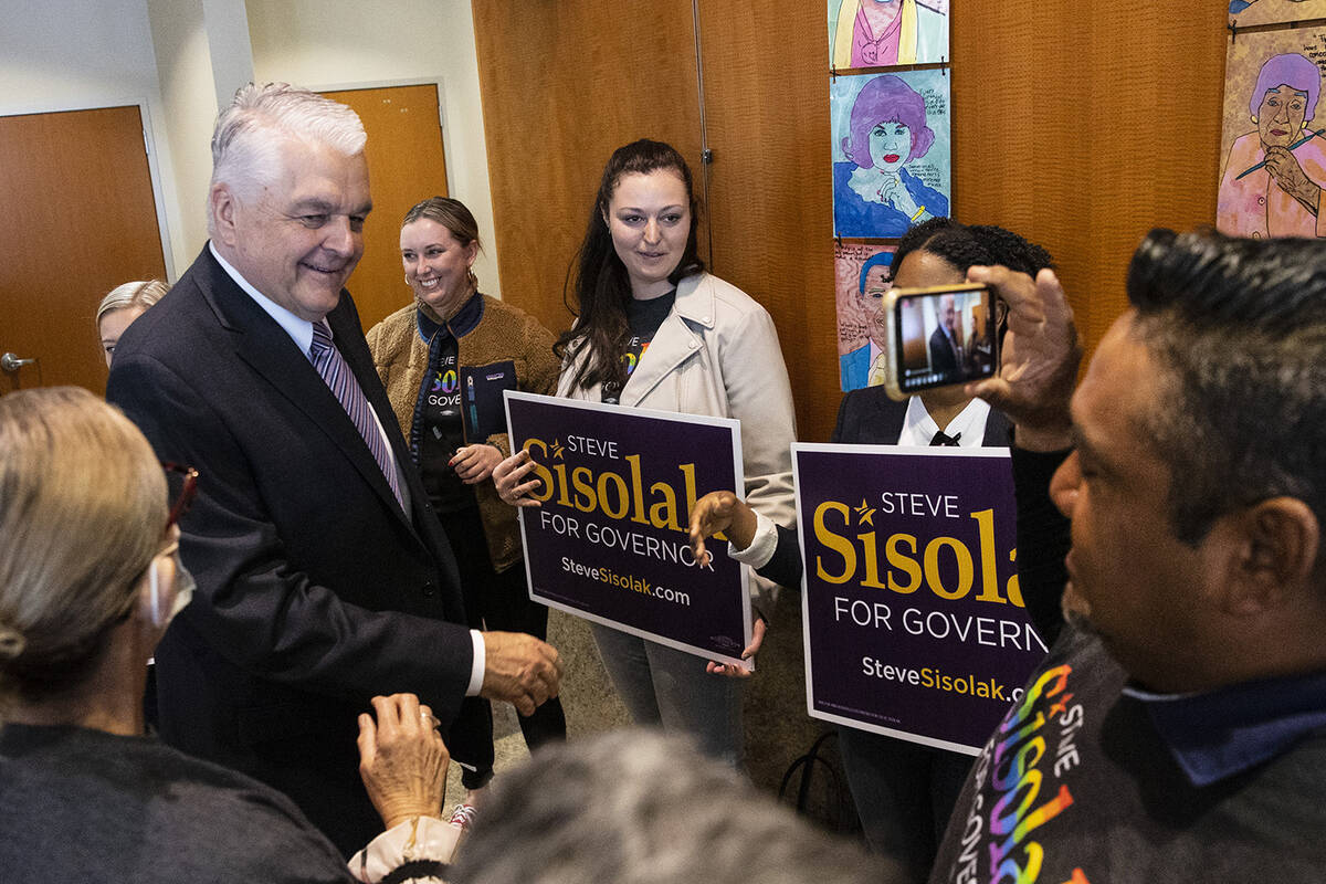 Gov. Steve Sisolak greets his supporters after formally filing for re-election, which marks the ...