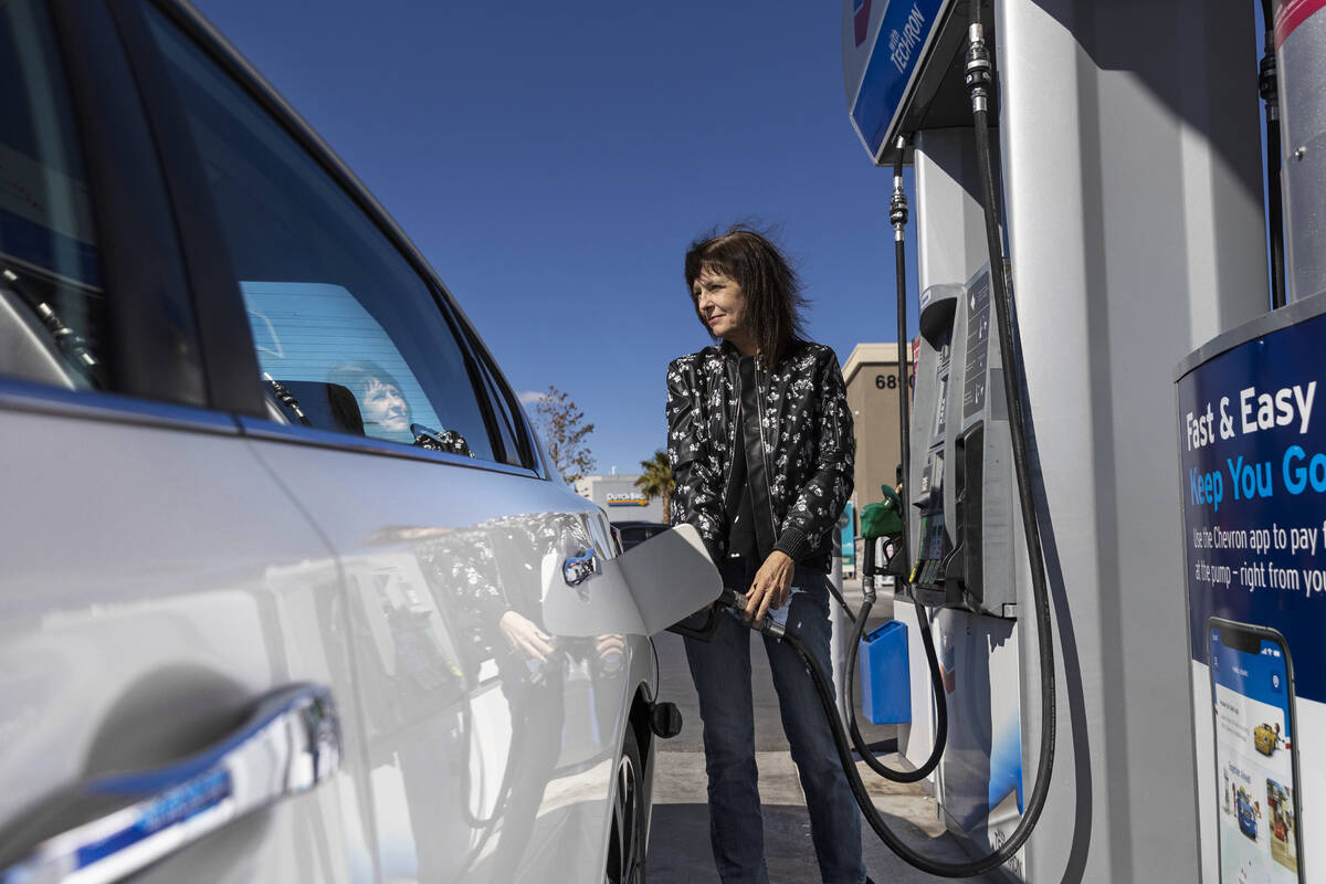 Laura Chapman fills up her car at Lucky Spot Chevron on Monday, March 7, 2022, in Las Vegas. (B ...