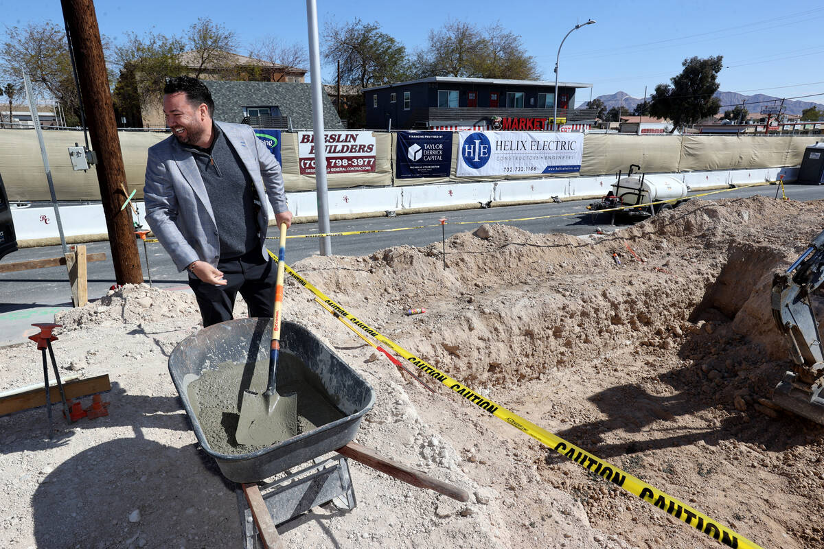 Developer Sam Cherry prepares to shovel concrete during a kickoff event at a five-story, 84-uni ...