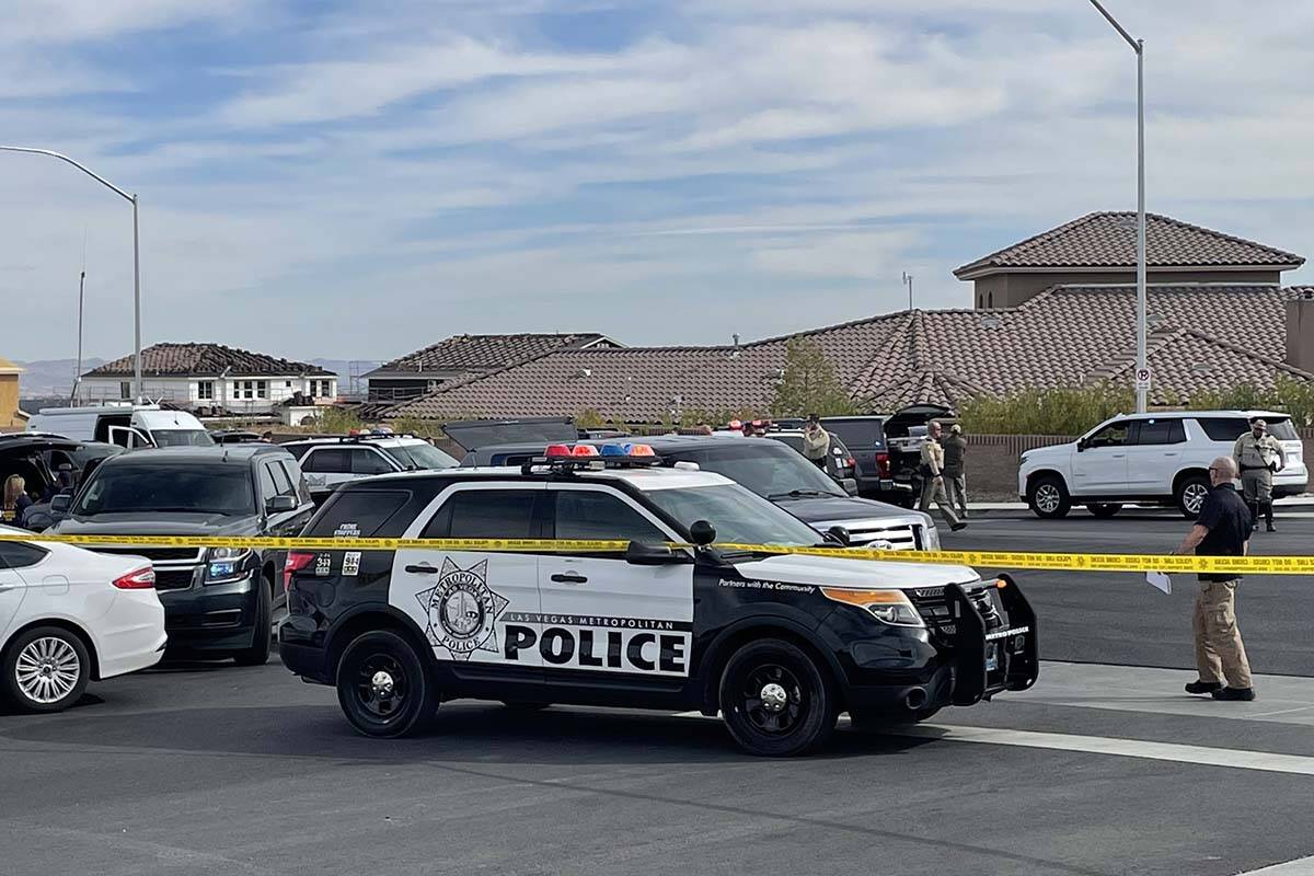 Las Vegas police and the FBI investigate a shooting on the 5000 block of Ruffian Road, near Wes ...