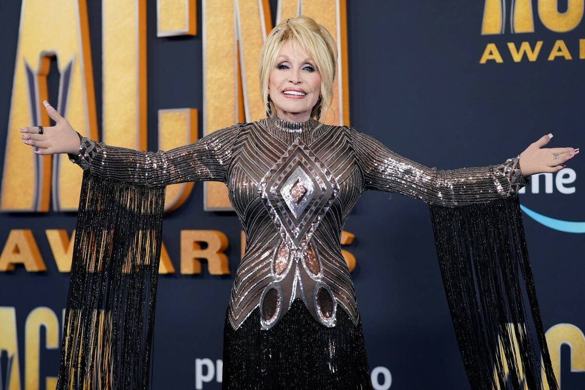 Dolly Parton arrives at the 57th Academy of Country Music Awards on Monday, March 7, 2022, at A ...
