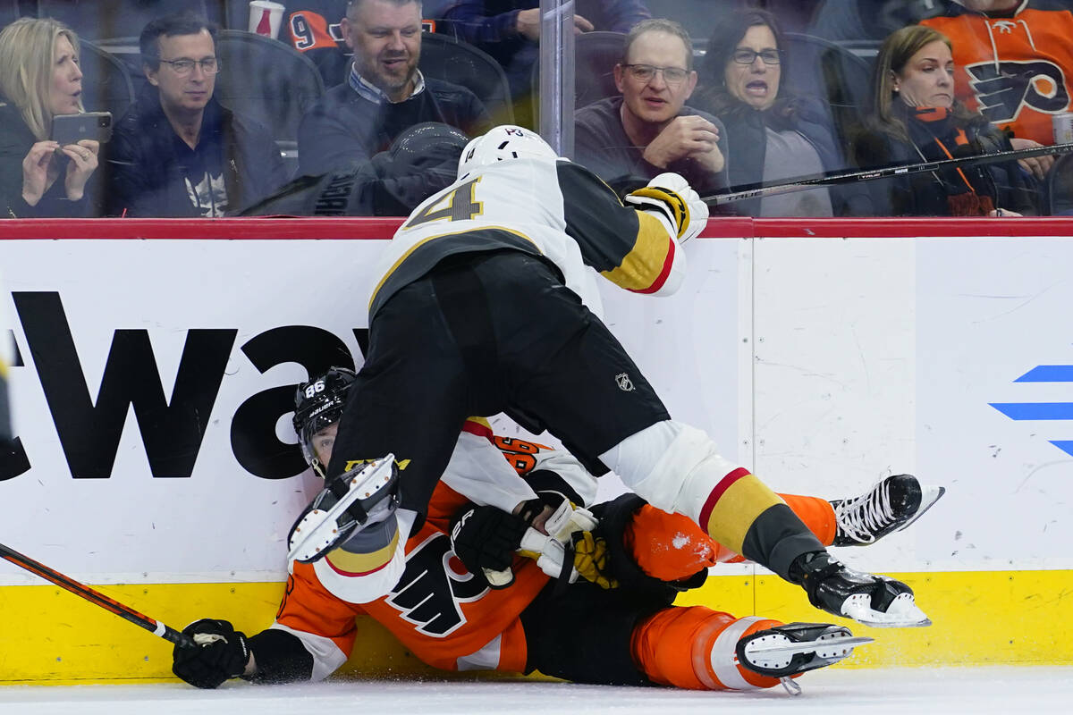 Philadelphia Flyers' Joel Farabee, left, and Vegas Golden Knights' Nicolas Hague collide during ...