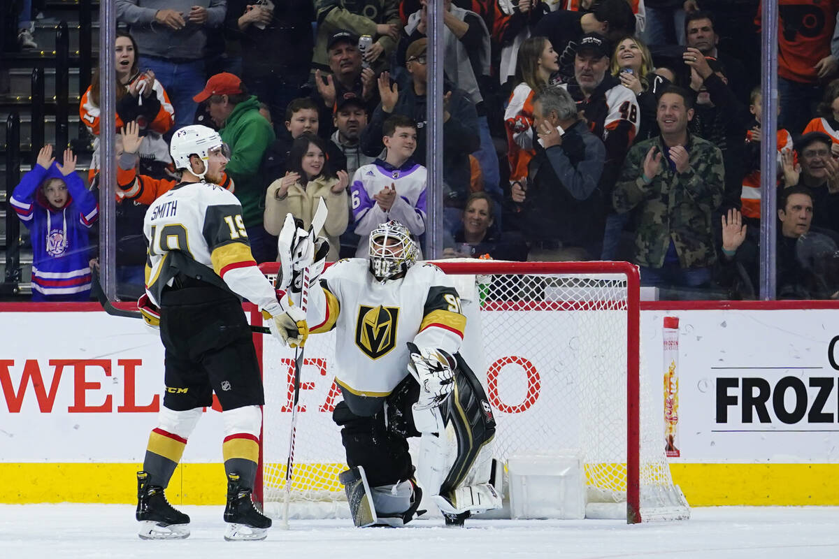Vegas Golden Knights' Reilly Smith, left, and Robin Lehner react after a goal by Philadelphia F ...