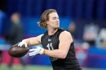 Pittsburgh quarterback Kenny Pickett runs a drill during the NFL football scouting combine, Thu ...