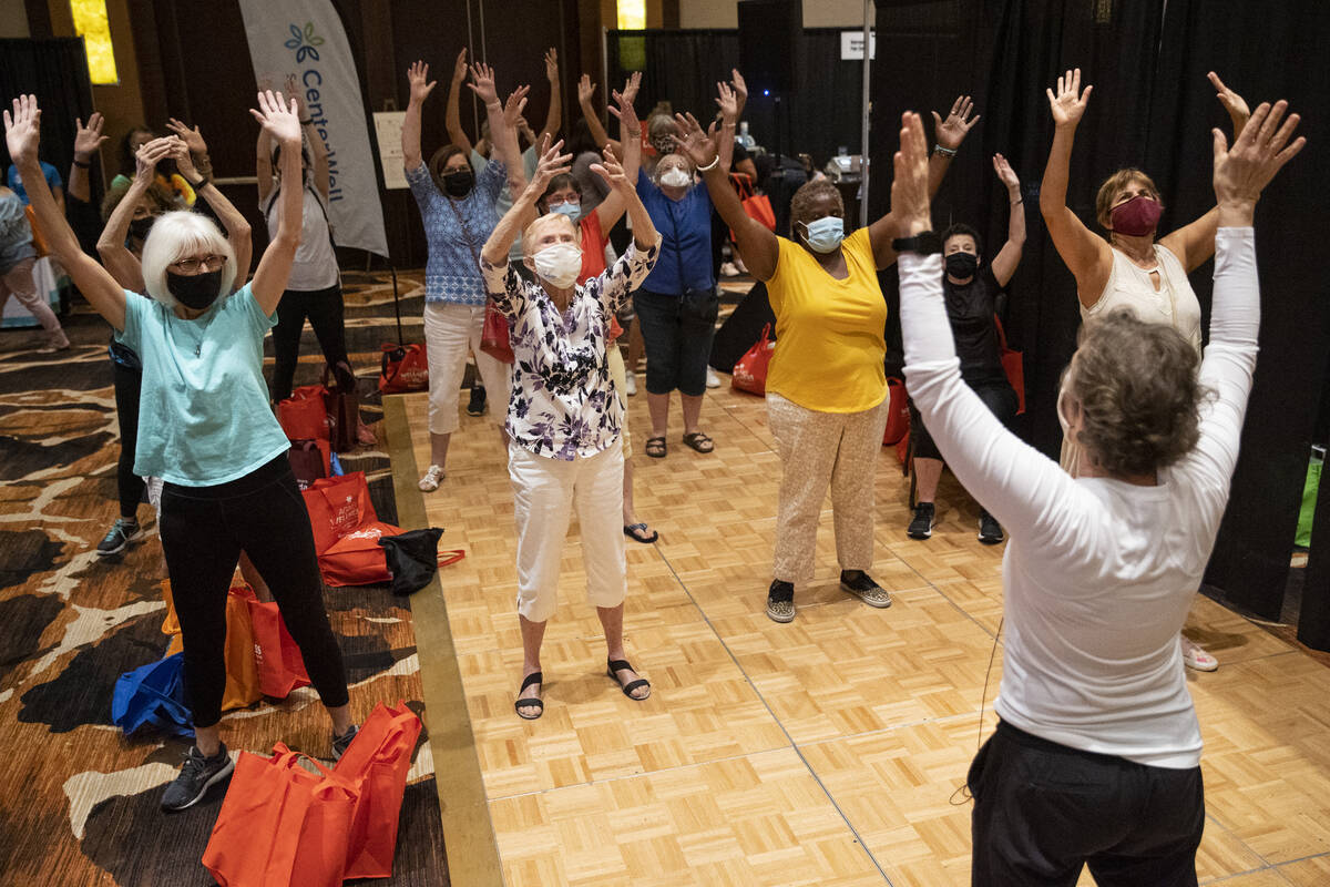 Visitors participate in a physical activity at the active Lounge by CenterWell Primary Care dur ...