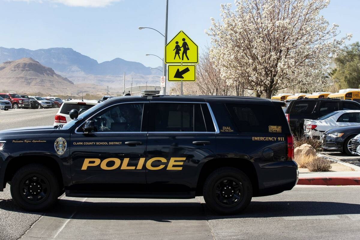 The Clark County School district police vehicle is seen as students at Desert Oasis leave their ...