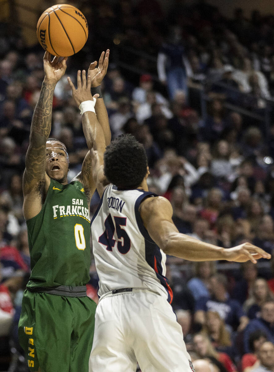 San Francisco Dons guard Jamaree Bouyea (1) shoots over Gonzaga Bulldogs guard Rasir Bolton (45 ...