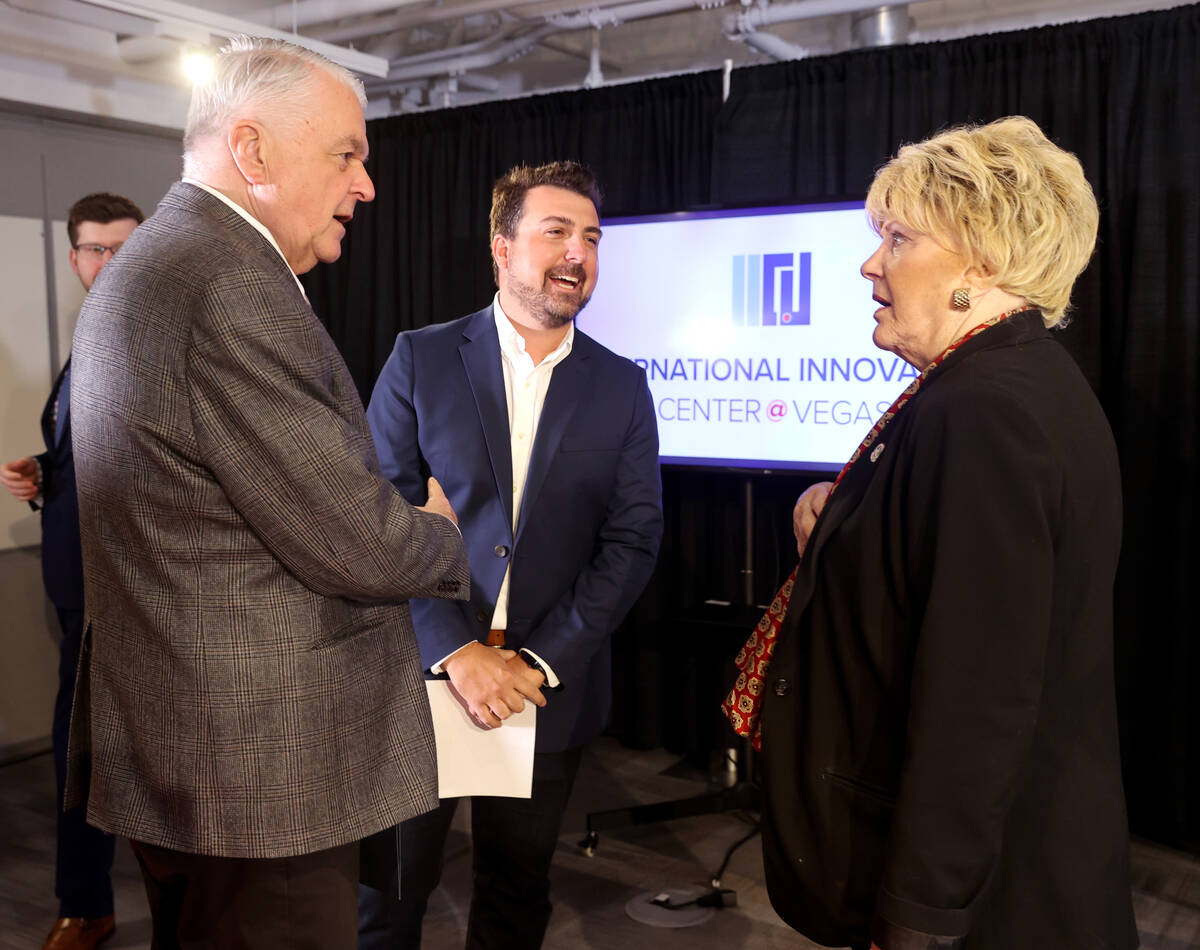 Nevada Gov. Steve Sisolak, left, and Las Vegas Mayor Carolyn Goodman mingle with gener8tor Co-F ...