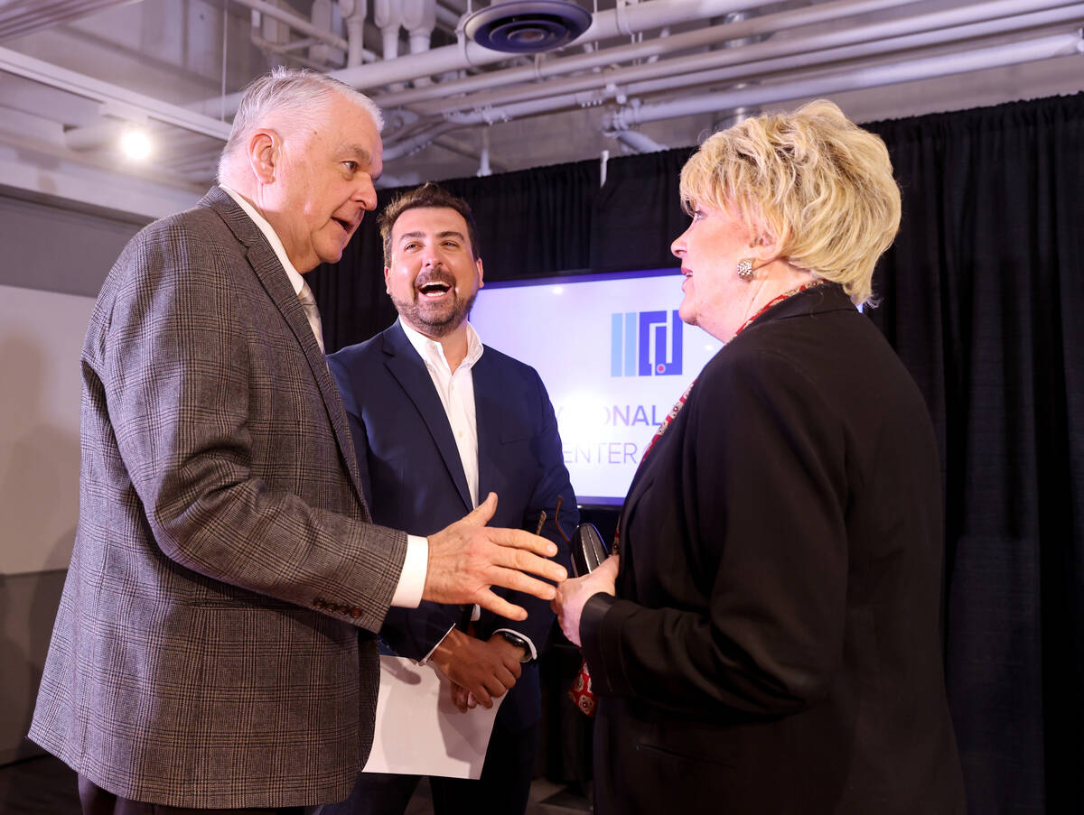 Nevada Gov. Steve Sisolak, left, and Las Vegas Mayor Carolyn Goodman mingle with gener8tor Co-F ...