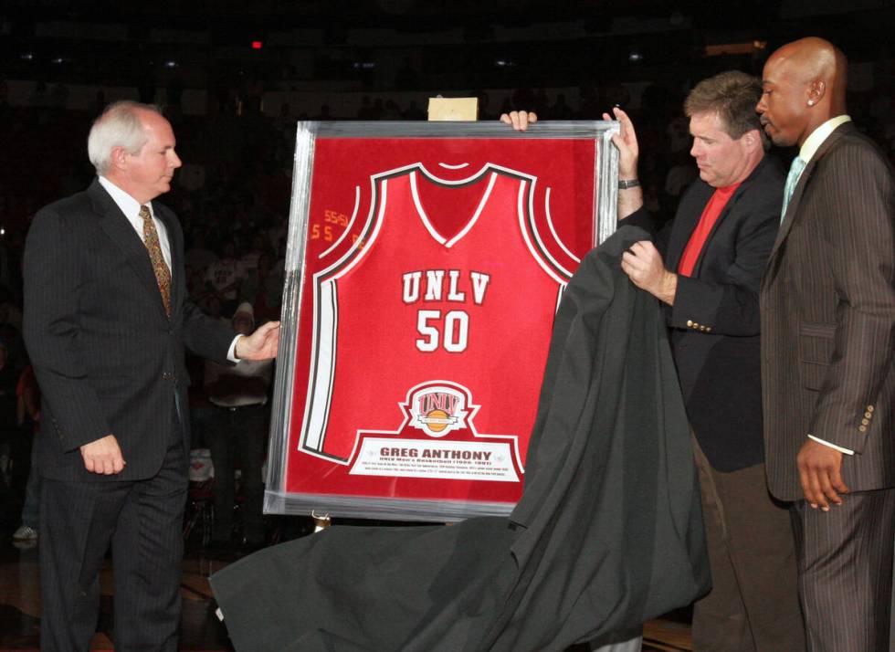 UNLV President David Ashley, left, athletic director Mike Hamrick, center, and former UNLV Runn ...