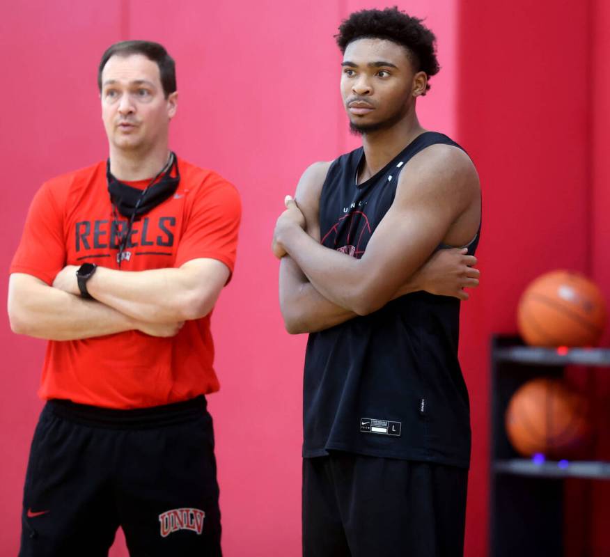 UNLV coach Kevin Kruger with guard Bryce Hamilton after practice at the Mendenhall Center in La ...