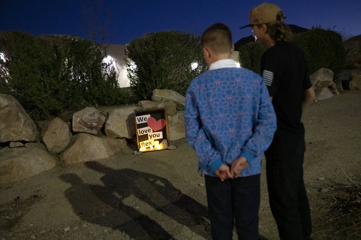 Neighborhood friends gather at the scene where teenager Rex Patchett was killed by a motorist w ...