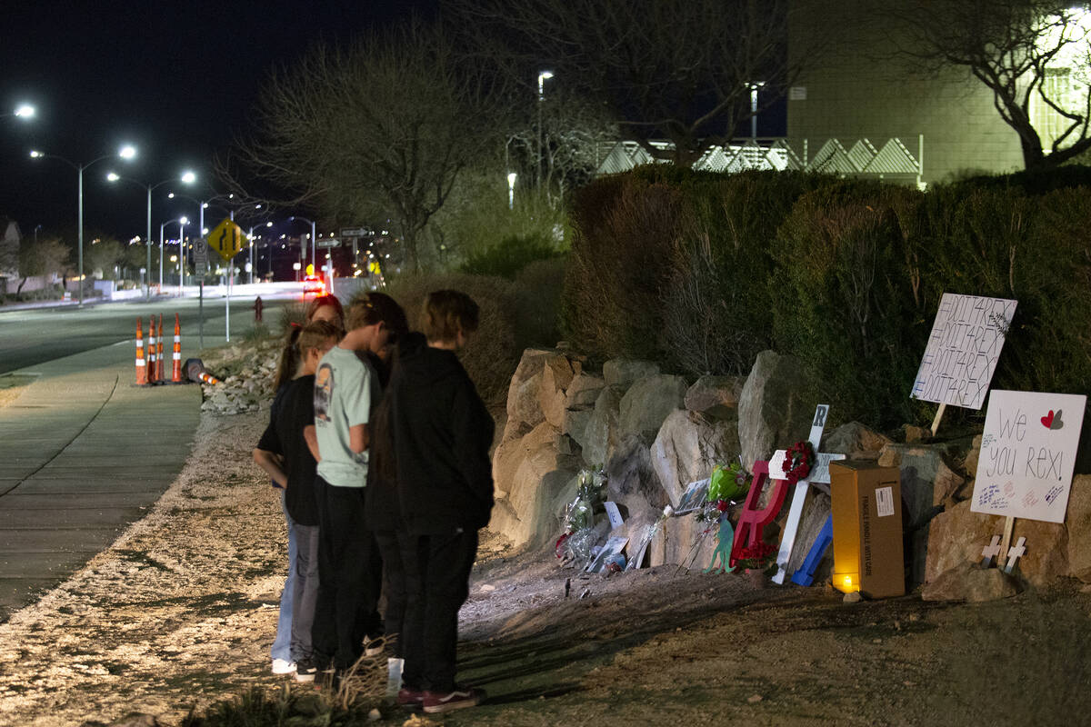 Neighborhood friends gather at the scene where teenager Rex Patchett was killed by a motorist w ...