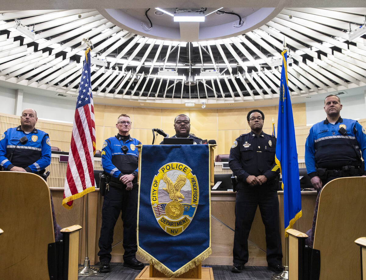 Henderson Police Department Chief Thedrick Andres, center, flanked by Sgt. Roger Matuszak, seco ...