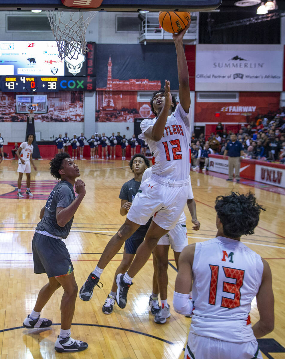 Mojave forward Amaris Quenum-Stewart (12)elevates for a basket over Spring Valley during the se ...