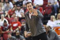 UNLV Rebels head coach Kevin Kruger motions to his team during the first half of a basketball g ...