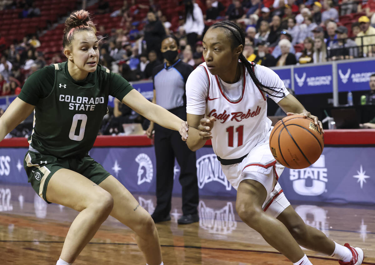 UNLV Lady Rebels guard Justice Ethridge (11) drives to the basket against Colorado State Rams f ...