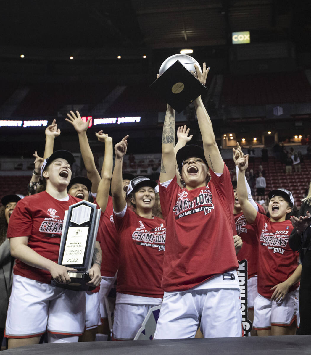 UNLV Lady Rebels guard Essence Booker, center right, who earned MVP honors, celebrates after de ...