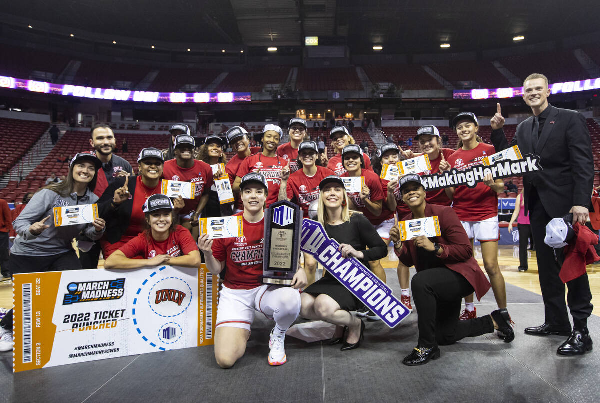 The UNLV Lady Rebels pose for a picture after defeating the Colorado State Rams 75-65 to win th ...