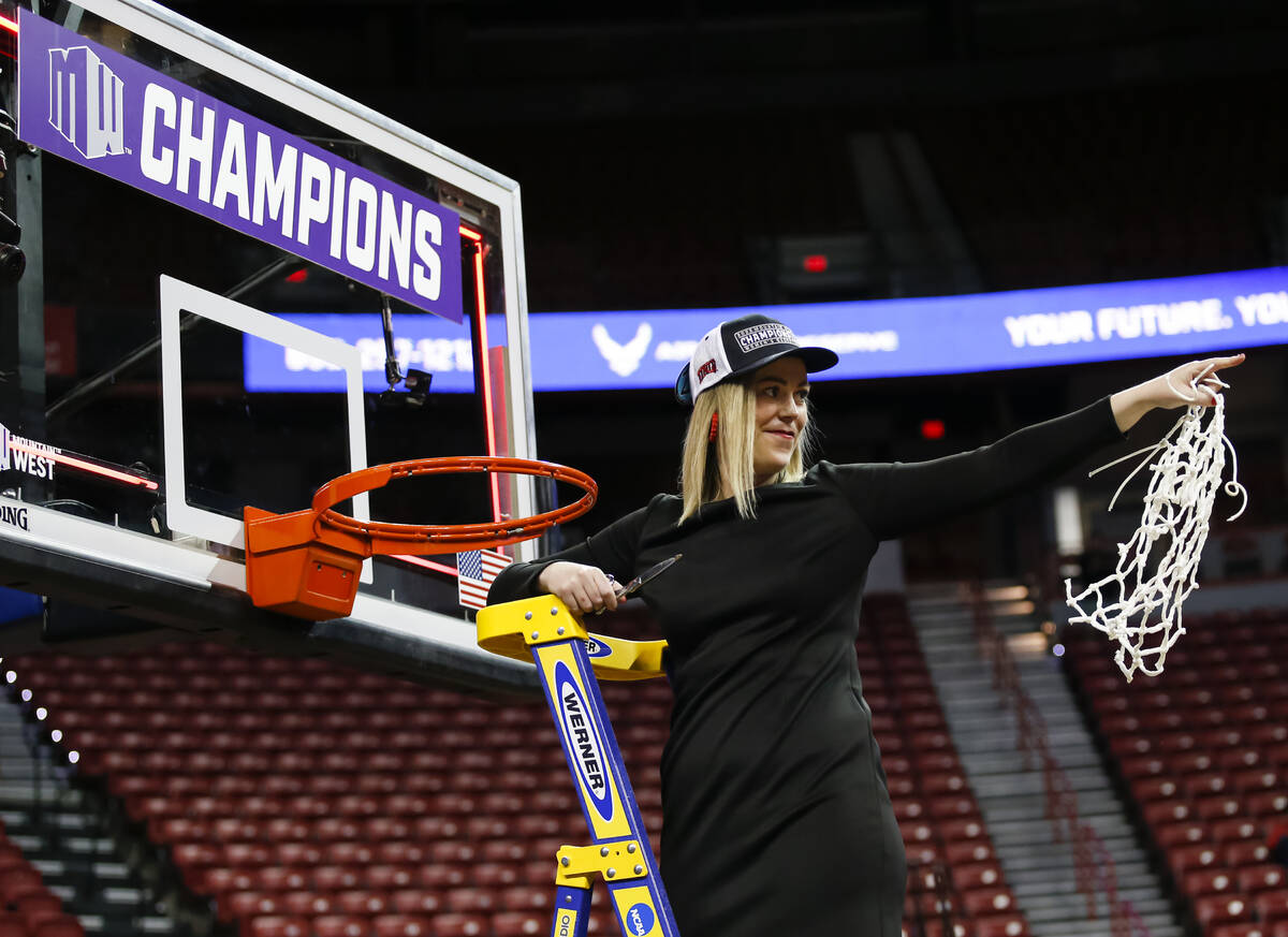 UNLV Lady Rebels head coach Lindy La Rocque reacts after cutting down the net after defeating t ...
