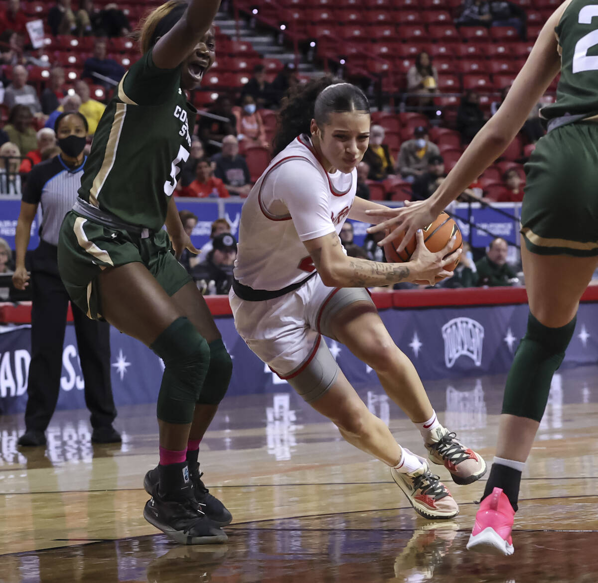 UNLV Lady Rebels guard Essence Booker (24) drives to the basket past Colorado State Rams guard ...