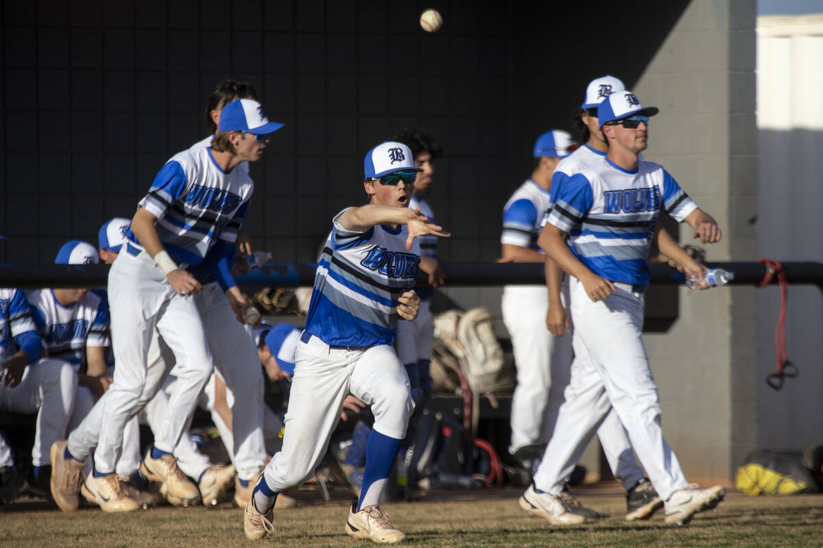 Basic players including Lorin Wicks, center, celebrate after their pitcher struck out Centennia ...