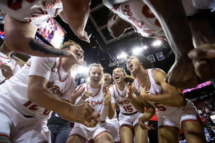 The UNLV Lady Rebels celebrate after defeating the Colorado State Rams 75-65 to win the Mountai ...