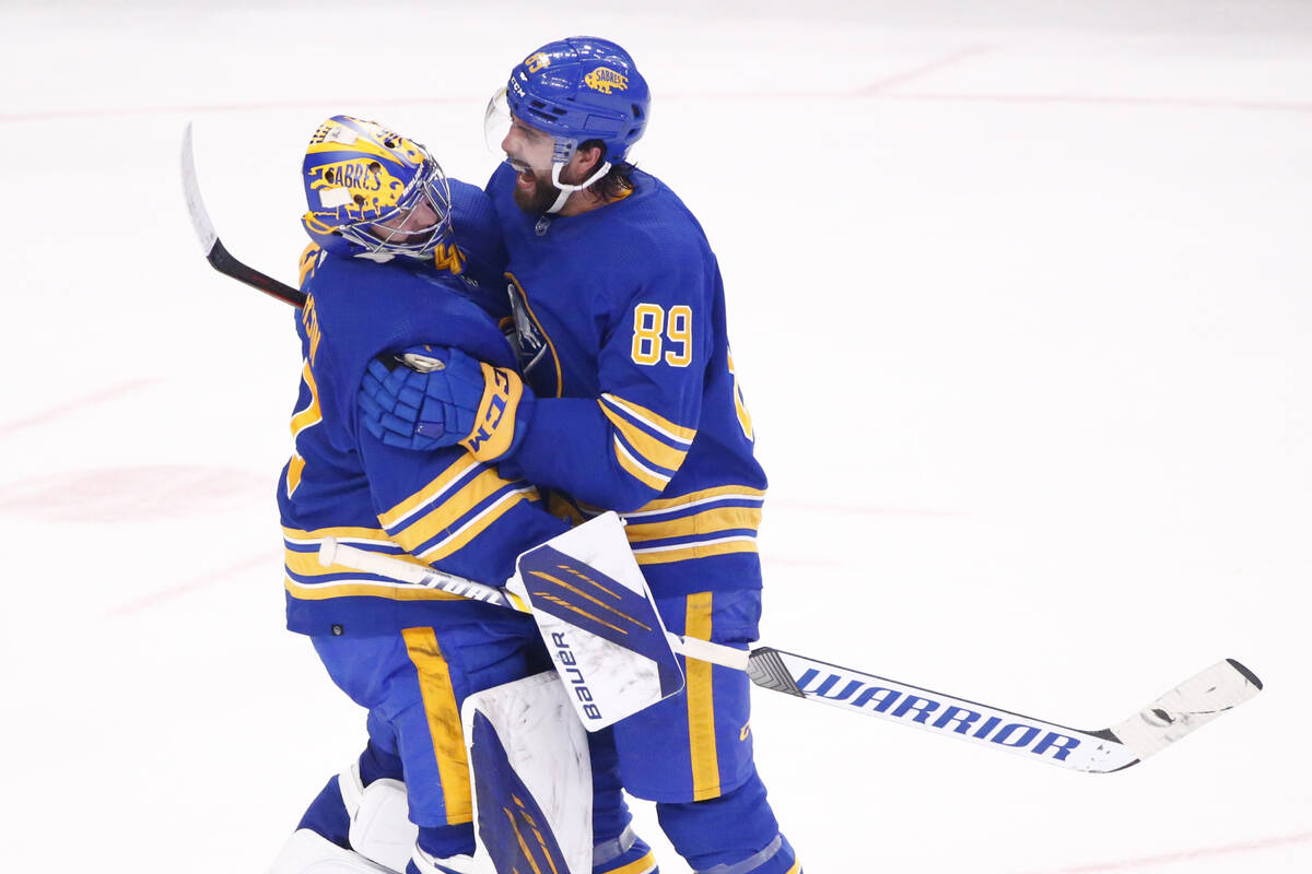Buffalo Sabres goaltender Craig Anderson (41) and right wing Alex Tuch (89) celebrate their vic ...