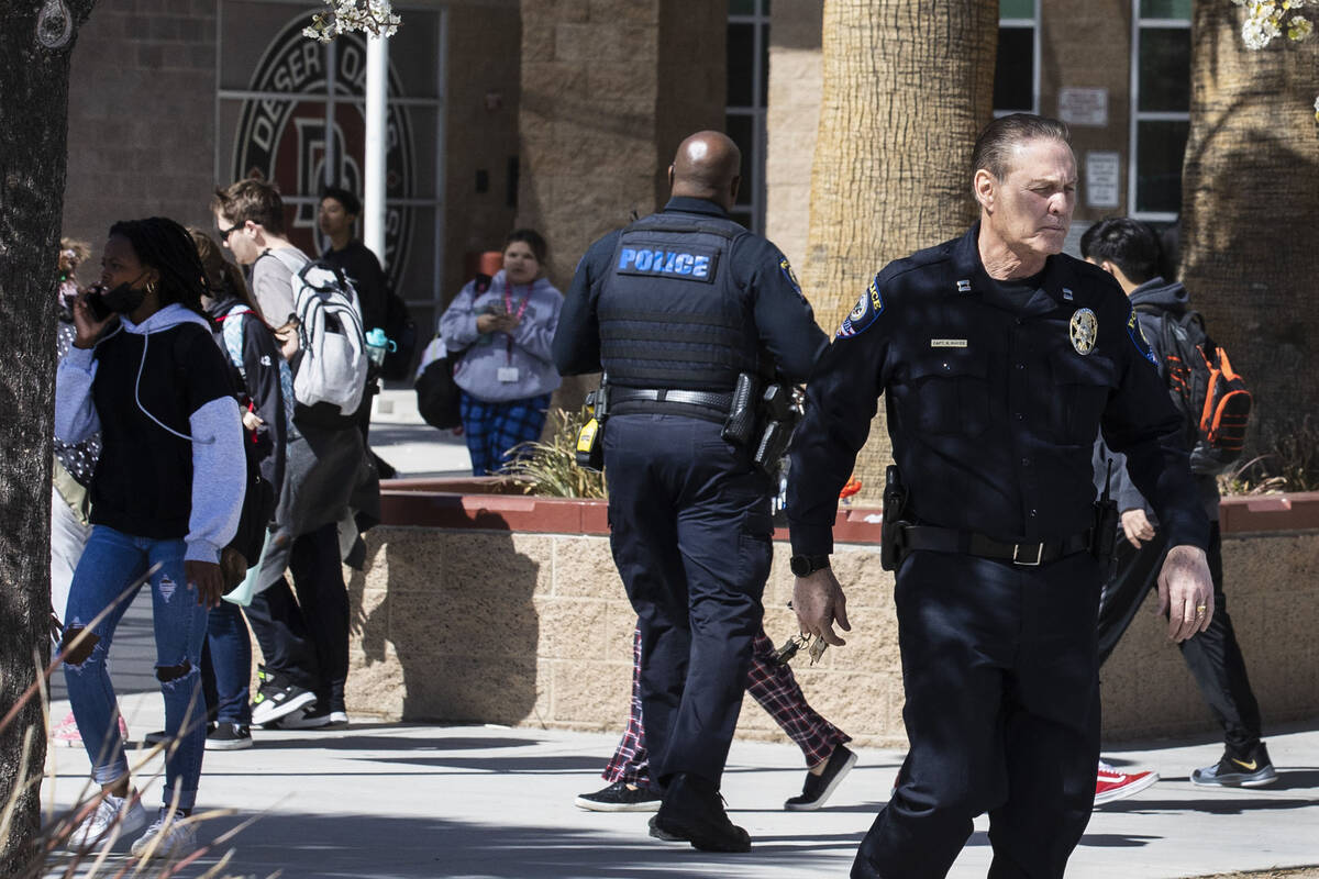 The Clark County School police are seen as students at Desert Oasis leave their school on Thurs ...