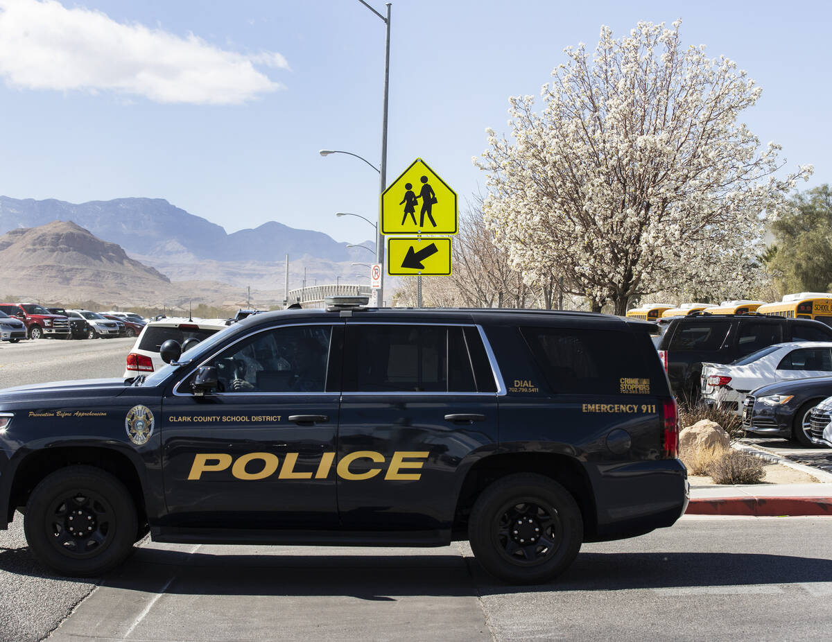 The Clark County School police vehicle is seen as students at Desert Oasis leave their school o ...