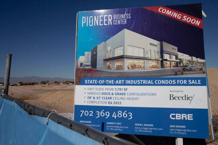 Signage at a construction site where Canadian developer Beedie is underway on a two-building in ...