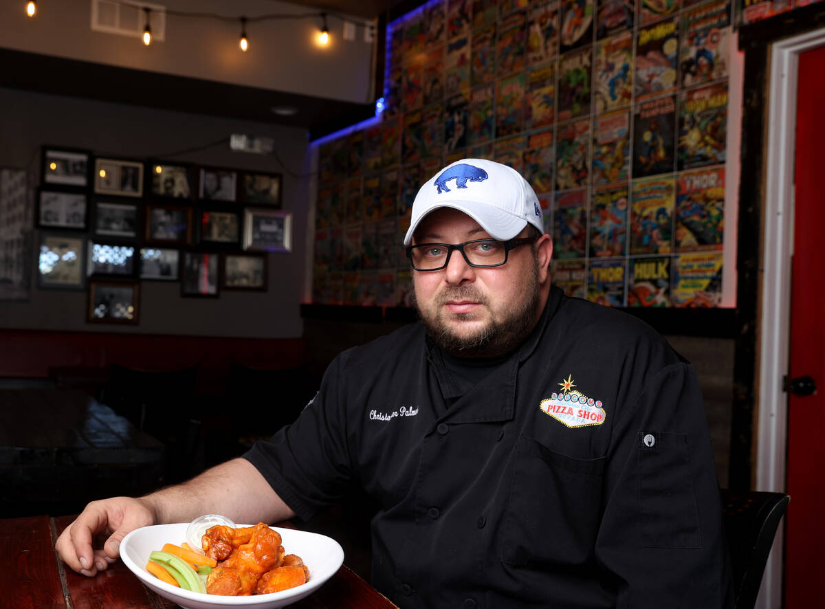 Naked City Pizza owner Chris Palmeri with his signature chicken wings at his Paradise Road loca ...