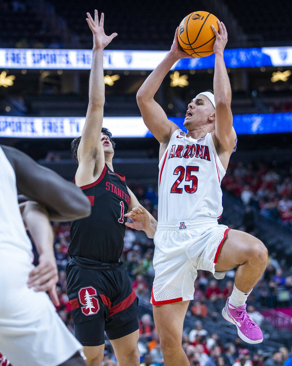 Arizona Wildcats guard Kerr Kriisa (25) elevates for a shot past Stanford Cardinal guard Isa Si ...