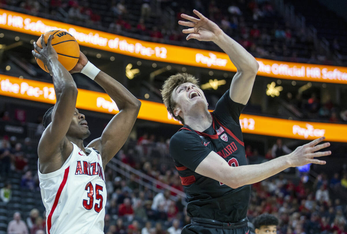 Arizona Wildcats center Christian Koloko (35) takes possession as he and Stanford Cardinal forw ...