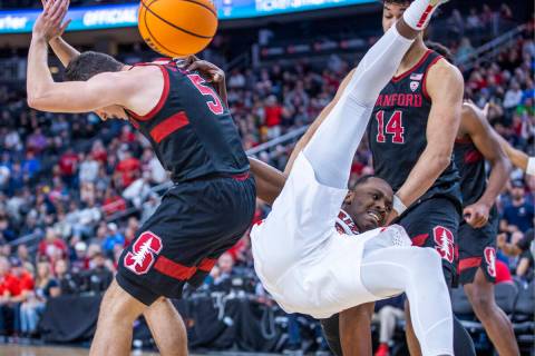 Stanford Cardinal guard Michael O'Connell (5) and Arizona Wildcats guard Bennedict Mathurin (0) ...