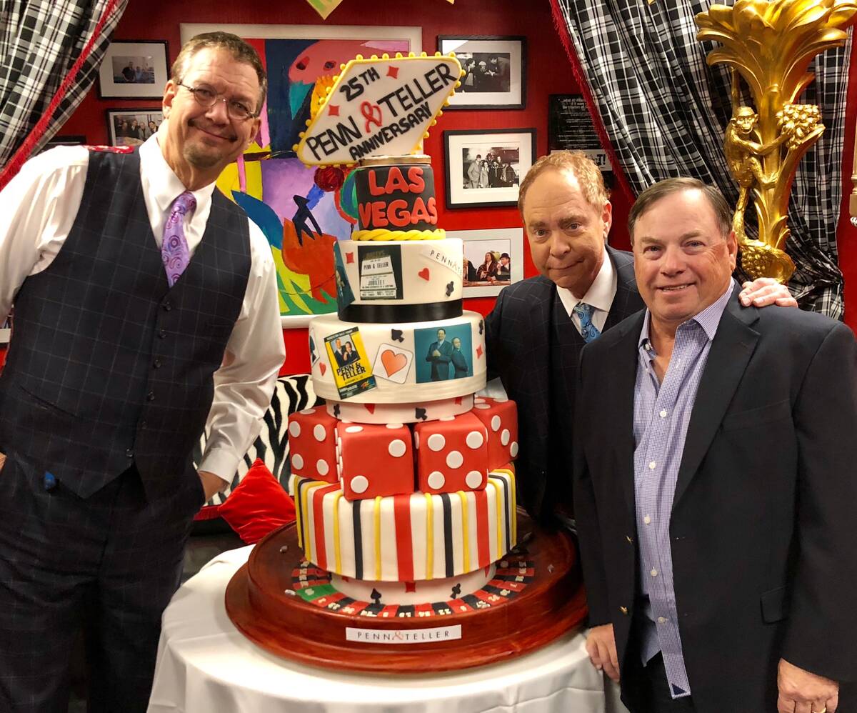 Penn & Teller are shown with Joel Fischman, who died of cancer on Thursday, March 10, 2022, in ...