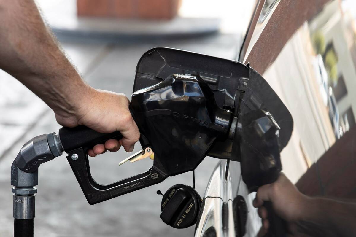 David Newman of Las Vegas pumps gas at Terrible’s on Torrey Pines Drive on Monday, March 7, 2 ...